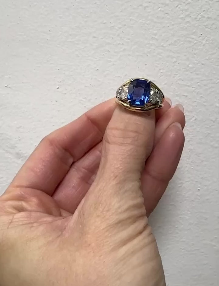 Blue Cushion Sapphire with Oval Diamond Side Stones